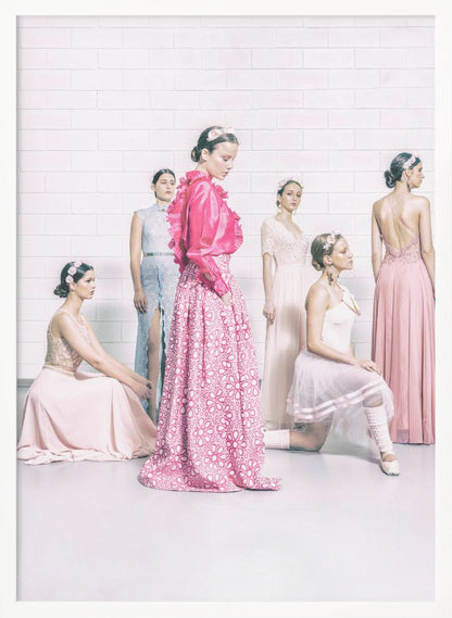 A studio photograph of six young women in elegant pastel gowns posing against a white brick wall. The central figure wears a vibrant pink ruffled blouse and a patterned maxi skirt, while the others are dressed in light pink, white, and pale blue dresses, some with ballet-inspired elements. They all have flowers in their hair, creating a soft, high-fashion aesthetic. Print