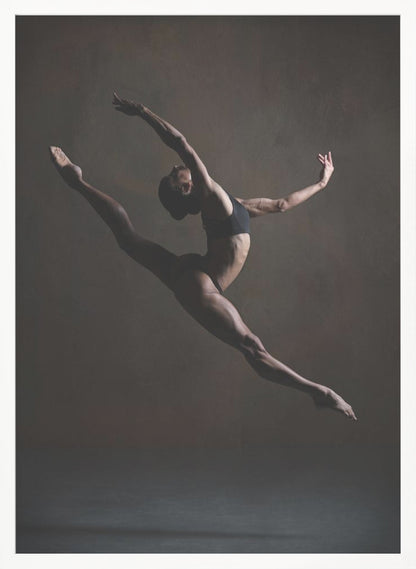 A dramatic, low-key studio photograph of a muscular female dancer captured mid-leap. She is in a full split, arching her back with her arms extended gracefully. The lighting accentuates her toned physique against a dark, textured brown background. Poster