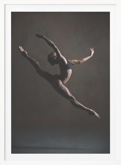 A dramatic, low-key studio photograph of a muscular female dancer captured mid-leap. She is in a full split, arching her back with her arms extended gracefully. The lighting accentuates her toned physique against a dark, textured brown background. Poster