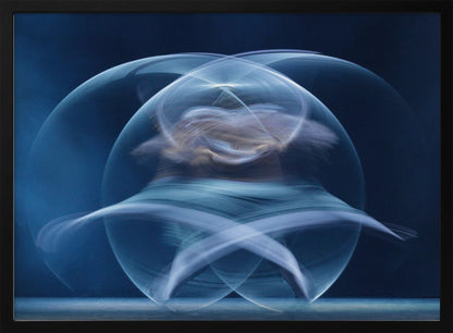 An abstract long-exposure photograph of a spinning dancer, creating ethereal, intersecting trails of blue and white light that form a glowing, orb-like shape against a deep blue background. The image is presented within a silver frame. Poster