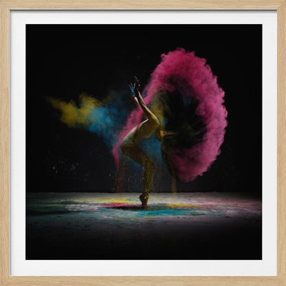 A dynamic photo of a dancer arching backward, their long hair creating a massive arc of vibrant pink powder against a black background, with smaller bursts of blue and yellow. Decor