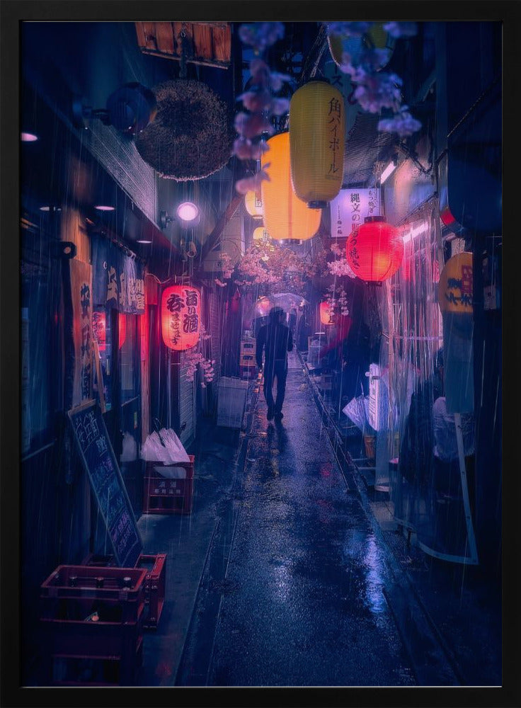 A lone figure walks down a narrow, rain-slicked Japanese alley at night. Colorful paper lanterns hang overhead, casting warm orange and red light that reflects on the wet ground, contrasting with the cool blue tones of the evening. Wall Art