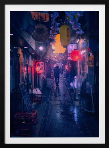 A lone figure walks down a narrow, rain-slicked Japanese alley at night. Colorful paper lanterns hang overhead, casting warm orange and red light that reflects on the wet ground, contrasting with the cool blue tones of the evening. Wall Art