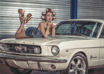 A woman in a retro pin-up style lies on the hood of a vintage white Ford Mustang in a garage, applying red lipstick with her hair set in soda can curlers. Poster