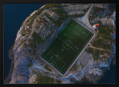 An art print featuring a distant view of a football field under a wide sky, evoking a sense of space and tranquility. Wall Art