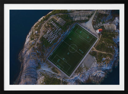 An art print featuring a distant view of a football field under a wide sky, evoking a sense of space and tranquility. Wall Art