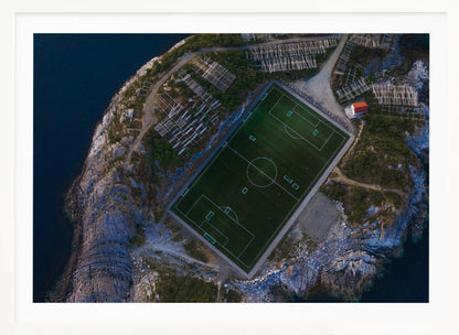 An art print featuring a distant view of a football field under a wide sky, evoking a sense of space and tranquility. Wall Art