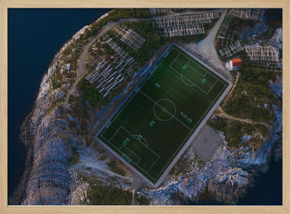 An art print featuring a distant view of a football field under a wide sky, evoking a sense of space and tranquility. Wall Art