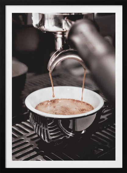 A close-up, desaturated photograph of an espresso machine pouring two streams of rich brown coffee from a chrome portafilter into an ornate black and white cup. Poster