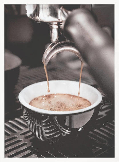 A close-up, desaturated photograph of an espresso machine pouring two streams of rich brown coffee from a chrome portafilter into an ornate black and white cup. Poster