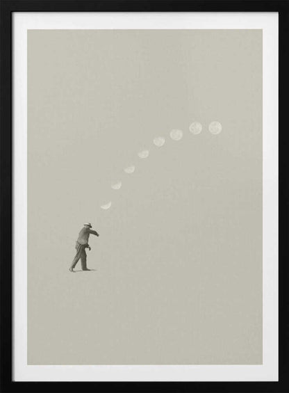 A man tosses the phases of the moon into the sky in a surreal, minimalist art piece.