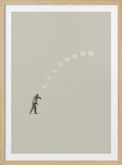 A man tosses the phases of the moon into the sky in a surreal, minimalist art piece.