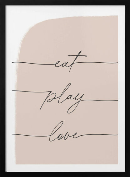 A modern typographic art print in a black frame. The words 'eat', 'play', and 'love' are written in a black cursive script, each on a separate line against a pale pink painted background. Print