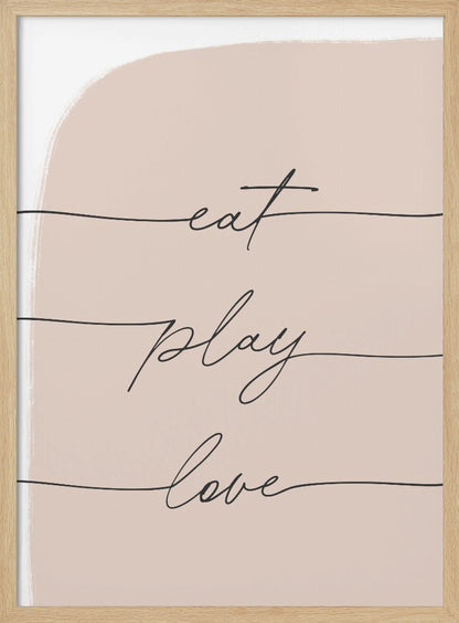 A modern typographic art print in a black frame. The words 'eat', 'play', and 'love' are written in a black cursive script, each on a separate line against a pale pink painted background. Print