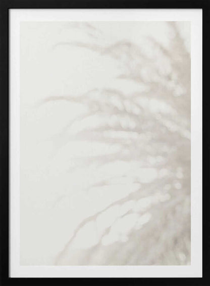 Soft focus photograph of a plant shadow on a light wall. Abstract and calming beige wall art with a minimalist feel.