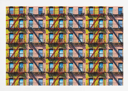 A pop-art style repeating pattern of a colorful apartment building facade featuring pink and yellow walls, windows reflecting a blue sky, and a network of black and red fire escapes, enclosed in a silver frame. Artwork