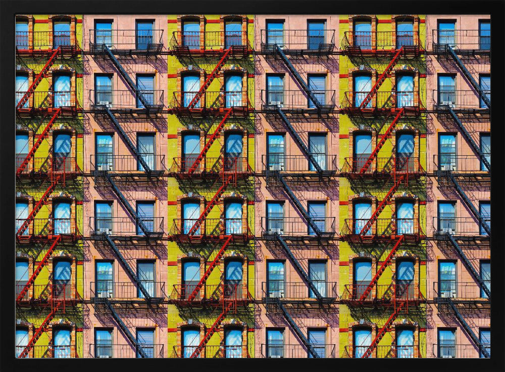 A pop-art style repeating pattern of a colorful apartment building facade featuring pink and yellow walls, windows reflecting a blue sky, and a network of black and red fire escapes, enclosed in a silver frame. Artwork