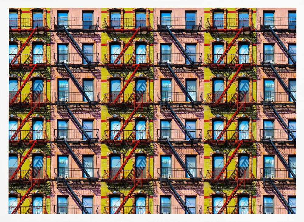 A pop-art style repeating pattern of a colorful apartment building facade featuring pink and yellow walls, windows reflecting a blue sky, and a network of black and red fire escapes, enclosed in a silver frame. Artwork