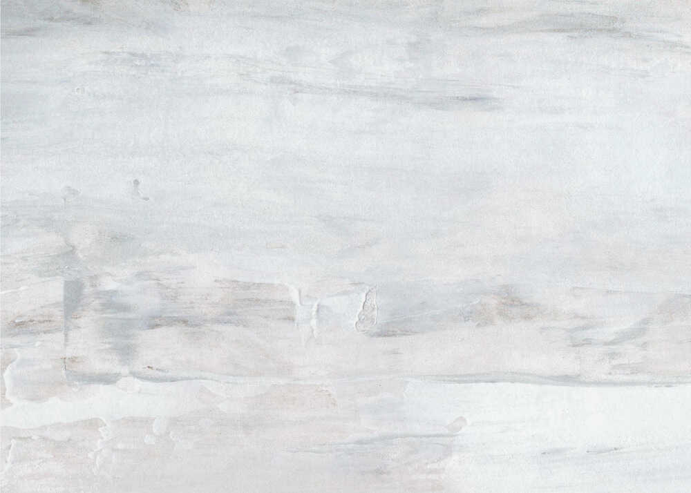 Abstract wall art with textured white and grey brushstrokes in a silver frame.