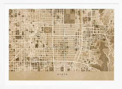 A framed, stylized map of Kyoto, Japan, in shades of brown and beige. The city streets are illustrated as a complex grid of off-white lines against a textured brown background. At the bottom, a solid beige banner contains the text 'KYOTO' and 'JAPAN' in a modern sans-serif font. The artwork is surrounded by a brushed silver frame. Artwork