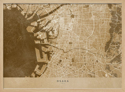 A framed, stylized map of Osaka, Japan, presented in monochrome brown and beige tones. The city's streets and coastline are intricately detailed in thin white lines against a textured brown background for the water and a lighter beige for the land, all enclosed within a sleek silver frame. Poster