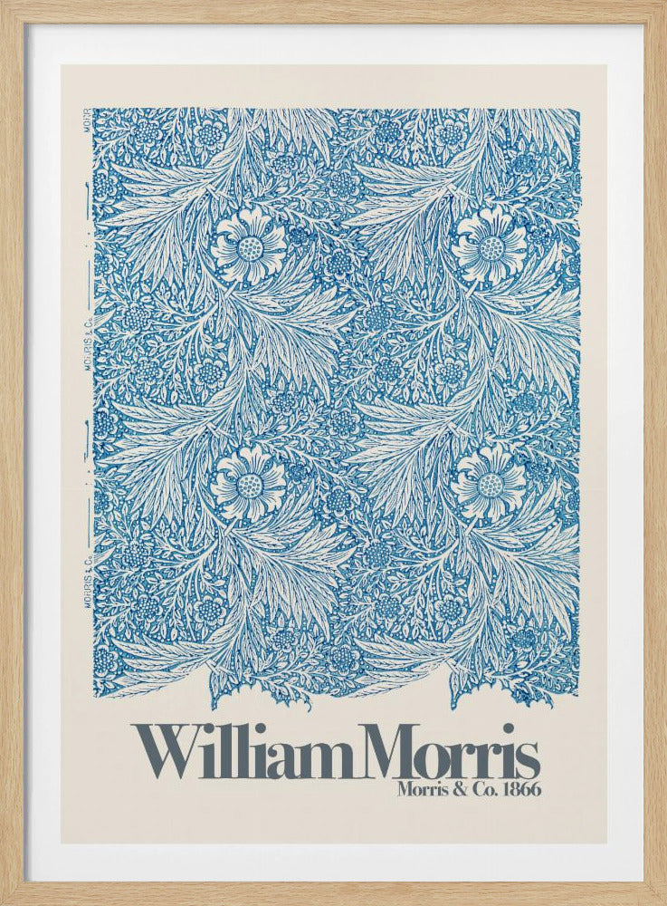 A framed art print of a William Morris design featuring an intricate, repeating floral and foliage pattern in blue on a white background. Below the pattern, the text 'William Morris' and 'Morris & Co. 1866' is printed in grey against a cream-colored border. Artwork