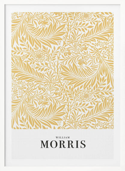 A framed exhibition-style poster of a William Morris design. The poster features an intricate, golden-yellow floral and leaf pattern on a white background. Below the pattern, the name 'WILLIAM MORRIS' is printed in black text. The entire artwork is presented in a simple black frame. Wall Art