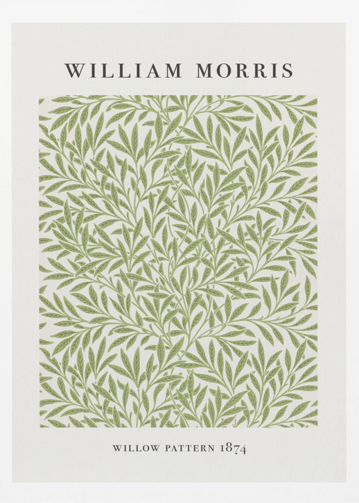 A framed art print of William Morris's 'Willow Pattern 1874'. The print features an intricate, repeating pattern of green willow branches and leaves on an off-white background, with the artist's name and pattern title in black text above and below the design. Print