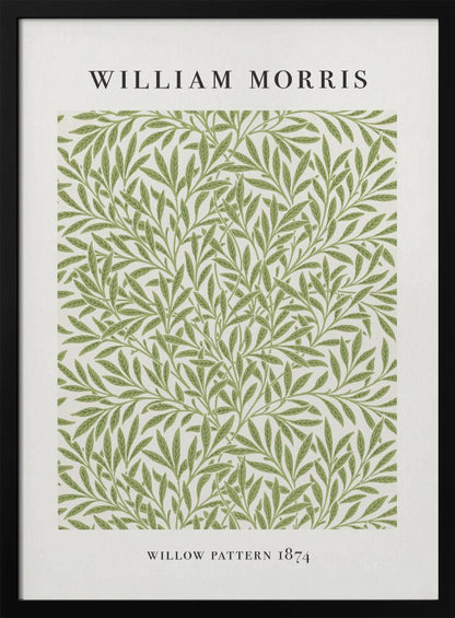A framed art print of William Morris's 'Willow Pattern 1874'. The print features an intricate, repeating pattern of green willow branches and leaves on an off-white background, with the artist's name and pattern title in black text above and below the design. Print
