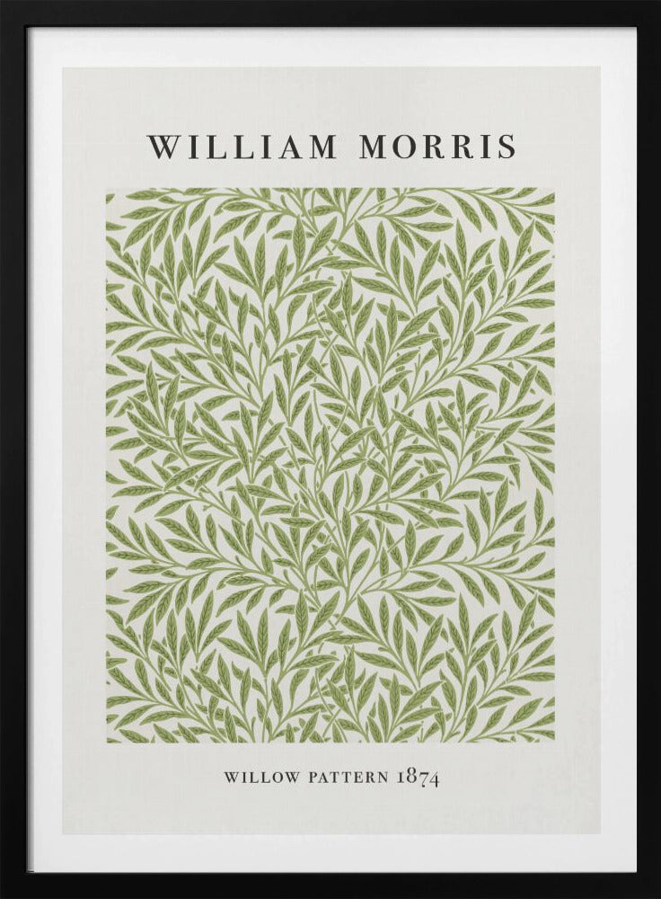 A framed art print of William Morris's 'Willow Pattern 1874'. The print features an intricate, repeating pattern of green willow branches and leaves on an off-white background, with the artist's name and pattern title in black text above and below the design. Print