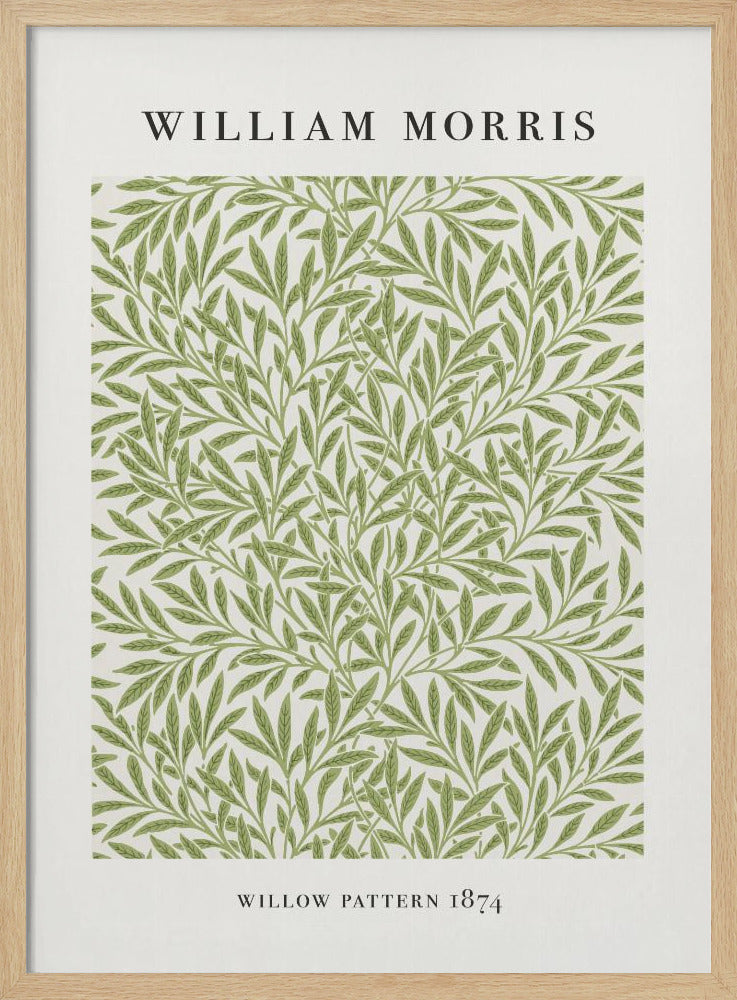 A framed art print of William Morris's 'Willow Pattern 1874'. The print features an intricate, repeating pattern of green willow branches and leaves on an off-white background, with the artist's name and pattern title in black text above and below the design. Print