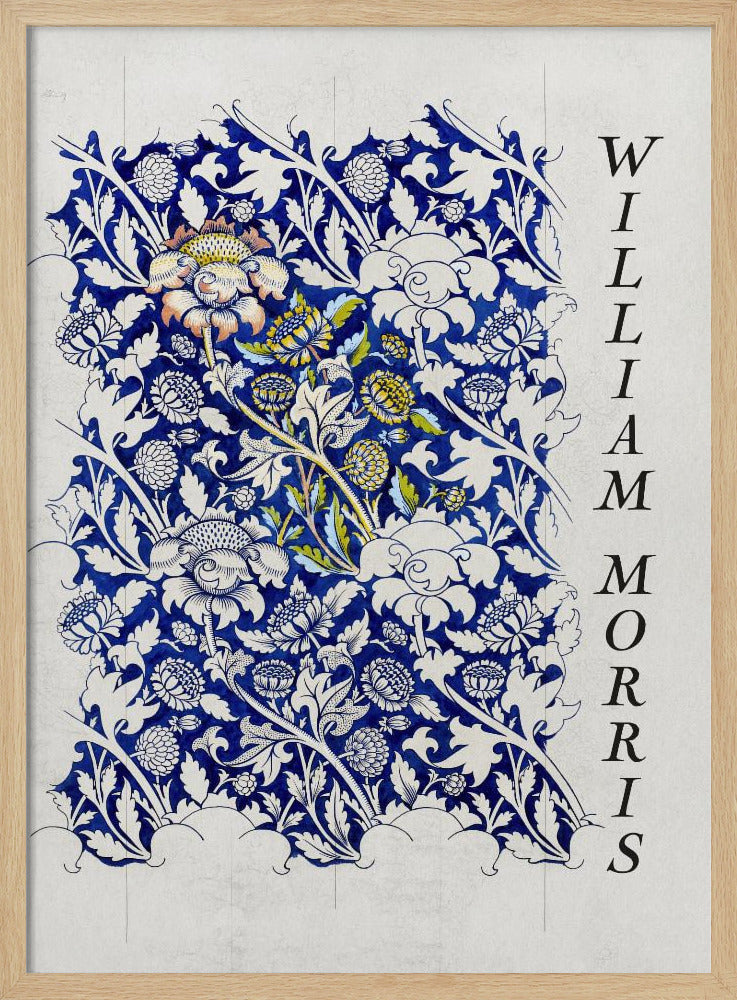 A vintage art print by William Morris featuring an intricate blue and white floral pattern on a light gray, textured background. The design swatch shows stylized flowers and acanthus leaves, with some central flowers highlighted in yellow and peach. The name 'WILLIAM MORRIS' is printed vertically in a black serif font along the right edge. The print is displayed in a thin black frame. Decor