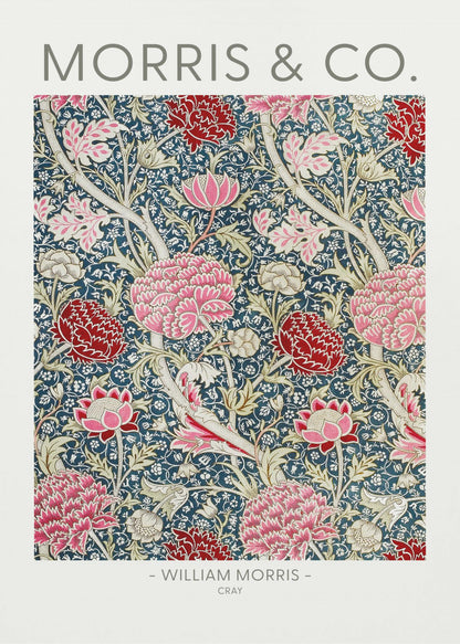 A framed art print of William Morris's 'Cray' pattern, featuring a dense floral design with large pink and red stylized flowers and foliage on a dark navy blue background. The text 'MORRIS & CO.' is above the pattern, and '- WILLIAM MORRIS - CRAY' is below. Artwork
