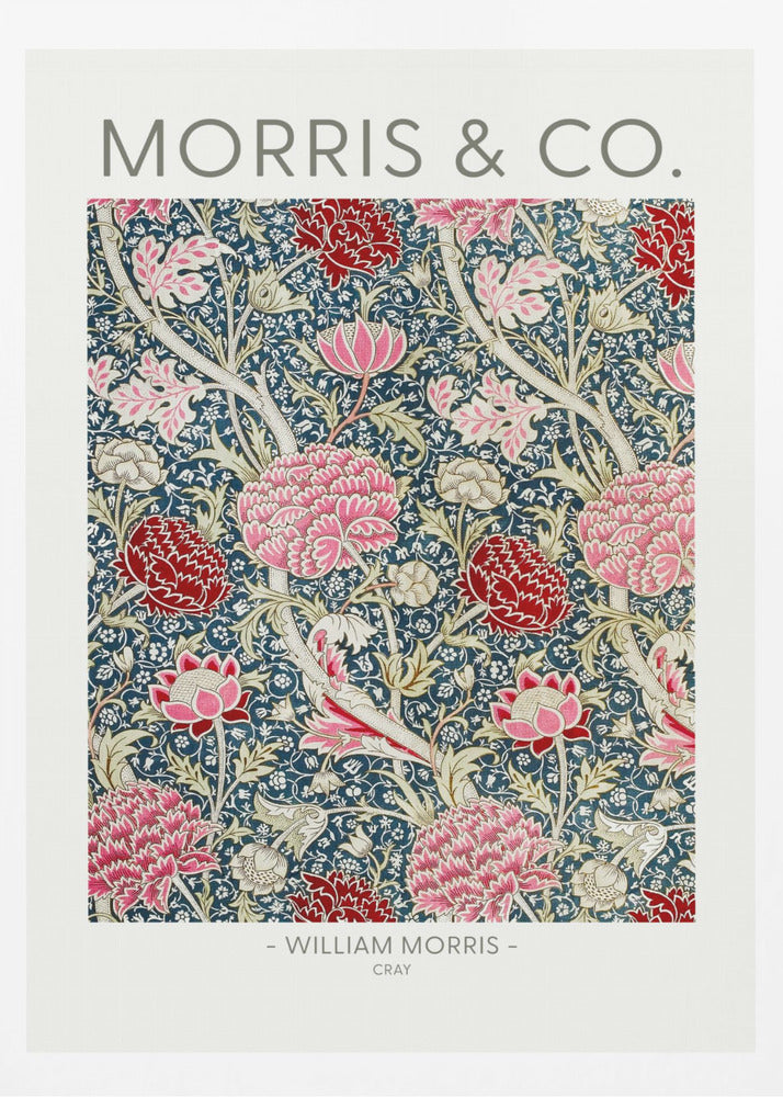 A framed art print of William Morris's 'Cray' pattern, featuring a dense floral design with large pink and red stylized flowers and foliage on a dark navy blue background. The text 'MORRIS & CO.' is above the pattern, and '- WILLIAM MORRIS - CRAY' is below. Artwork
