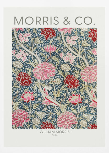 A framed art print of William Morris's 'Cray' pattern, featuring a dense floral design with large pink and red stylized flowers and foliage on a dark navy blue background. The text 'MORRIS & CO.' is above the pattern, and '- WILLIAM MORRIS - CRAY' is below. Artwork