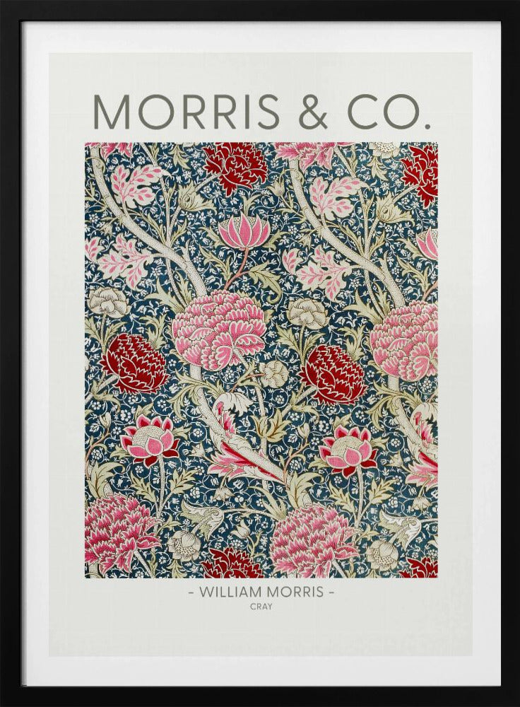A framed art print of William Morris's 'Cray' pattern, featuring a dense floral design with large pink and red stylized flowers and foliage on a dark navy blue background. The text 'MORRIS & CO.' is above the pattern, and '- WILLIAM MORRIS - CRAY' is below. Artwork