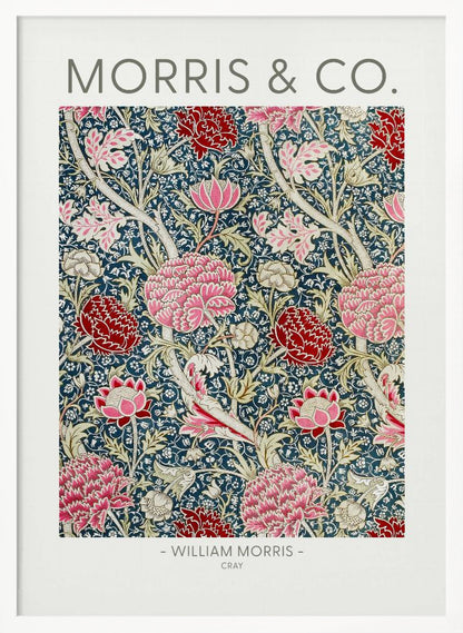 A framed art print of William Morris's 'Cray' pattern, featuring a dense floral design with large pink and red stylized flowers and foliage on a dark navy blue background. The text 'MORRIS & CO.' is above the pattern, and '- WILLIAM MORRIS - CRAY' is below. Artwork