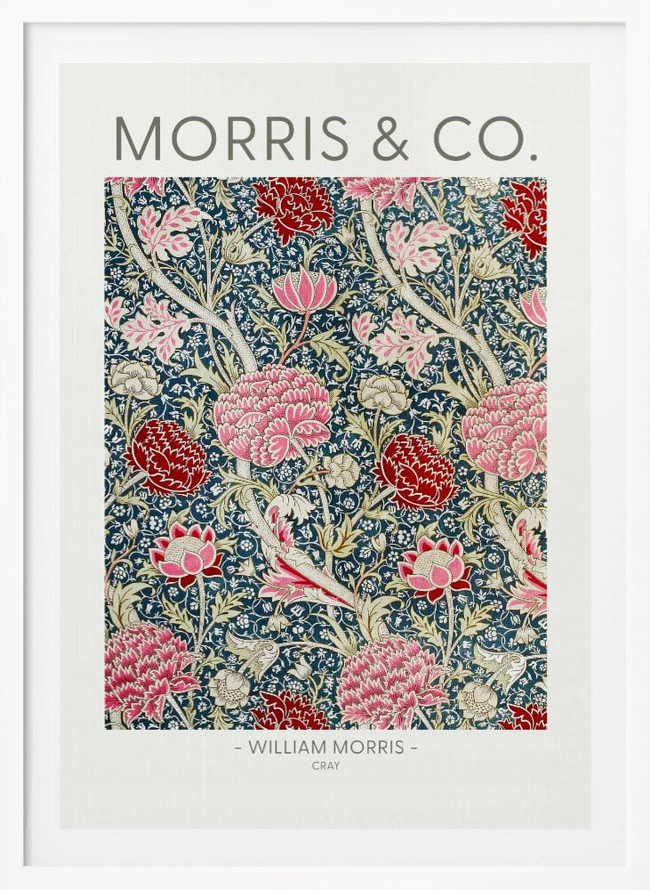 A framed art print of William Morris's 'Cray' pattern, featuring a dense floral design with large pink and red stylized flowers and foliage on a dark navy blue background. The text 'MORRIS & CO.' is above the pattern, and '- WILLIAM MORRIS - CRAY' is below. Artwork