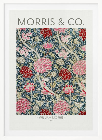 A framed art print of William Morris's 'Cray' pattern, featuring a dense floral design with large pink and red stylized flowers and foliage on a dark navy blue background. The text 'MORRIS & CO.' is above the pattern, and '- WILLIAM MORRIS - CRAY' is below. Artwork