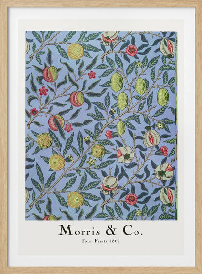 A framed art print of the 'Four Fruits 1862' pattern by Morris & Co. The intricate botanical design features various fruits like lemons, pomegranates, and oranges, along with red and yellow flowers, all intertwined on branches with dark green leaves against a light blue background. Poster