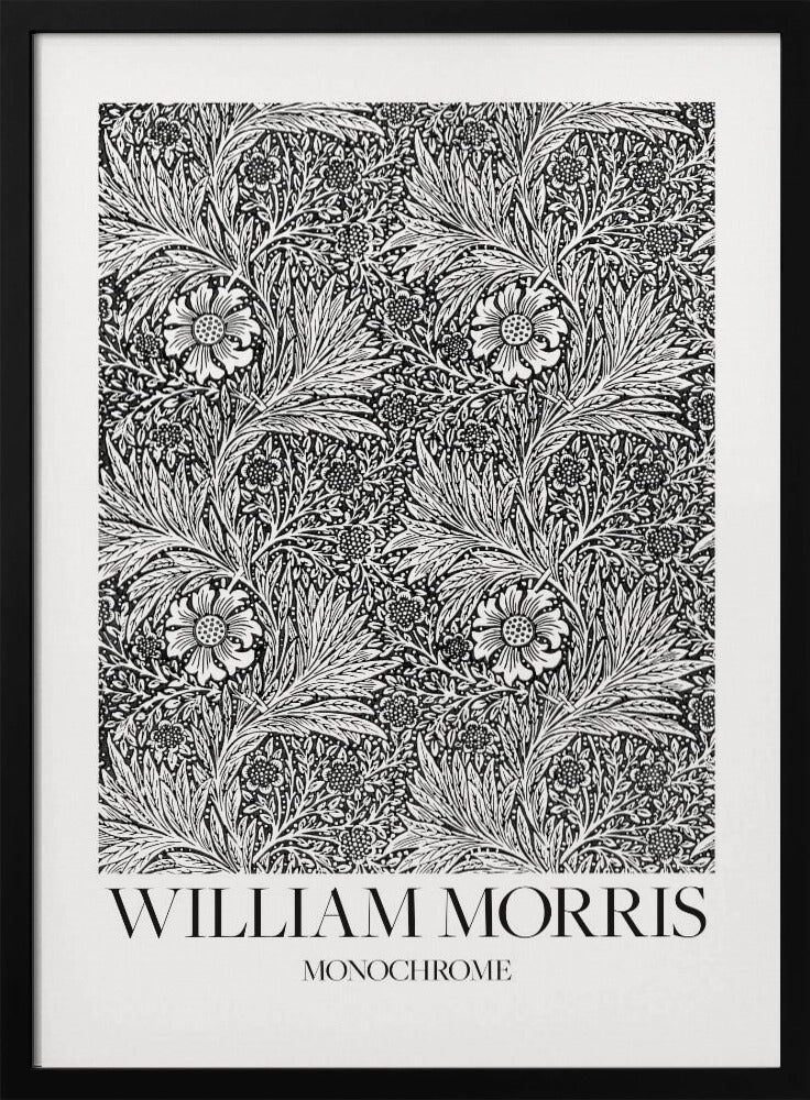 A framed art print featuring a classic William Morris pattern in monochrome. The intricate black and white design is filled with dense, swirling foliage and stylized flowers. The artwork has a white border, and at the bottom, the text 'WILLIAM MORRIS' is displayed prominently, with 'MONOCHROME' written underneath in a smaller font. Artwork