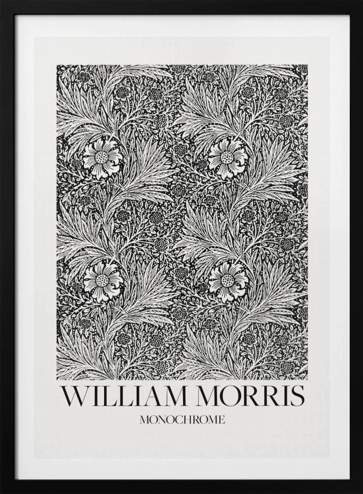 A framed art print featuring a classic William Morris pattern in monochrome. The intricate black and white design is filled with dense, swirling foliage and stylized flowers. The artwork has a white border, and at the bottom, the text 'WILLIAM MORRIS' is displayed prominently, with 'MONOCHROME' written underneath in a smaller font. Artwork