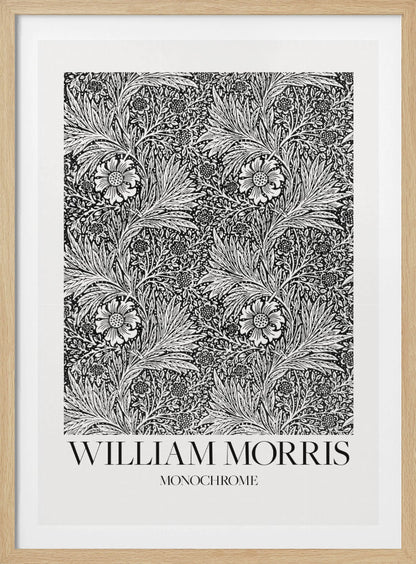 A framed art print featuring a classic William Morris pattern in monochrome. The intricate black and white design is filled with dense, swirling foliage and stylized flowers. The artwork has a white border, and at the bottom, the text 'WILLIAM MORRIS' is displayed prominently, with 'MONOCHROME' written underneath in a smaller font. Artwork