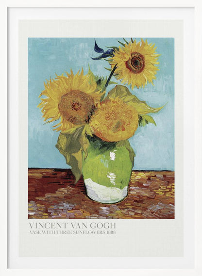 A framed art print of Vincent van Gogh's painting 'Vase with Three Sunflowers' from 1888. The artwork features three large, vibrant yellow sunflowers in a green vase set against a textured light blue background. The painting is in the post-impressionist style with thick, visible brushstrokes. The print has a white border with text at the bottom identifying the artist and title. Print