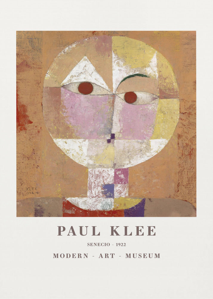 A framed museum poster of Paul Klee's 1922 painting 'Senecio'. The artwork is an abstract, geometric portrait of a human head in warm tones of orange, yellow, pink, and red against a textured brown background. The text 'PAUL KLEE', 'SENECIO - 1922', and 'MODERN - ART - MUSEUM' is printed below the image. Print