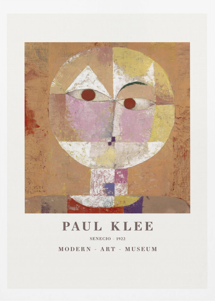 A framed museum poster of Paul Klee's 1922 painting 'Senecio'. The artwork is an abstract, geometric portrait of a human head in warm tones of orange, yellow, pink, and red against a textured brown background. The text 'PAUL KLEE', 'SENECIO - 1922', and 'MODERN - ART - MUSEUM' is printed below the image. Print