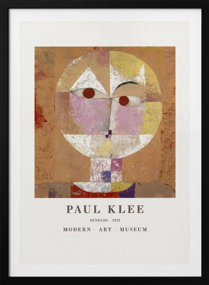 A framed museum poster of Paul Klee's 1922 painting 'Senecio'. The artwork is an abstract, geometric portrait of a human head in warm tones of orange, yellow, pink, and red against a textured brown background. The text 'PAUL KLEE', 'SENECIO - 1922', and 'MODERN - ART - MUSEUM' is printed below the image. Print
