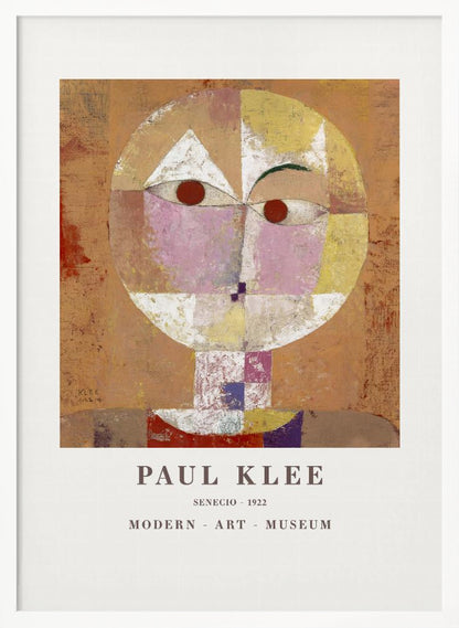 A framed museum poster of Paul Klee's 1922 painting 'Senecio'. The artwork is an abstract, geometric portrait of a human head in warm tones of orange, yellow, pink, and red against a textured brown background. The text 'PAUL KLEE', 'SENECIO - 1922', and 'MODERN - ART - MUSEUM' is printed below the image. Print