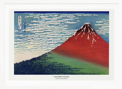 A framed Japanese woodblock print, 'Fine Wind, Clear Morning' by Katsushika Hokusai, also known as 'Red Fuji'. The print depicts a large, reddish-brown Mount Fuji with its peak lightly dusted with snow, set against a vibrant blue sky filled with white, streaky clouds. A dark green forest covers the base of the mountain. Poster