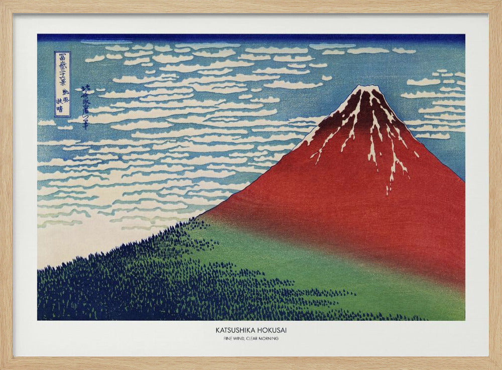 A framed Japanese woodblock print, 'Fine Wind, Clear Morning' by Katsushika Hokusai, also known as 'Red Fuji'. The print depicts a large, reddish-brown Mount Fuji with its peak lightly dusted with snow, set against a vibrant blue sky filled with white, streaky clouds. A dark green forest covers the base of the mountain. Poster